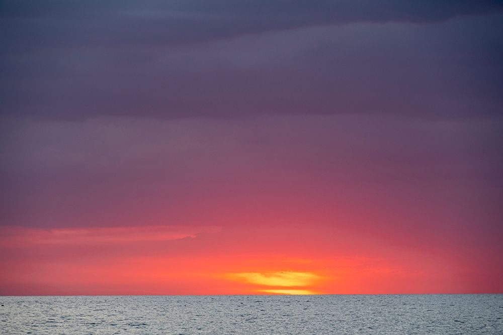 Sunset sky with clouds over ocean seen from La Boca-Cuba art print by Janis Miglavs for $57.95 CAD