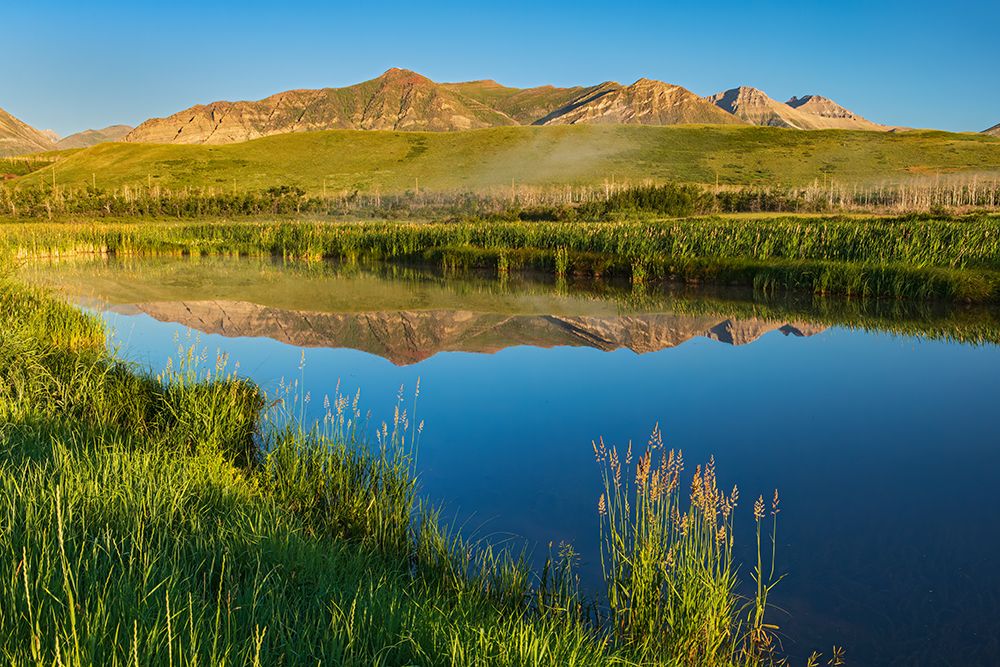 Canada-Alberta-Waterton Lakes NP Rocky Mountains reflected in Lower Waterton Lake at sunrise art print by Jaynes Gallery for $57.95 CAD