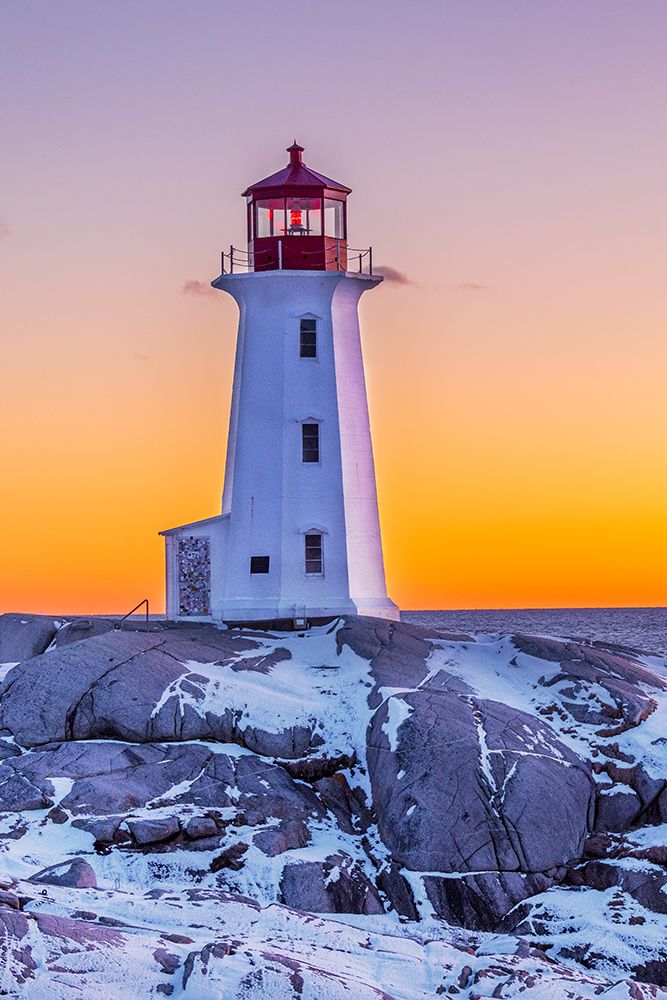 Peggys Cove Lighthouse in winter at sunset, Nova Scotia, Canada. art print by Richard and Susan Day for $57.95 CAD