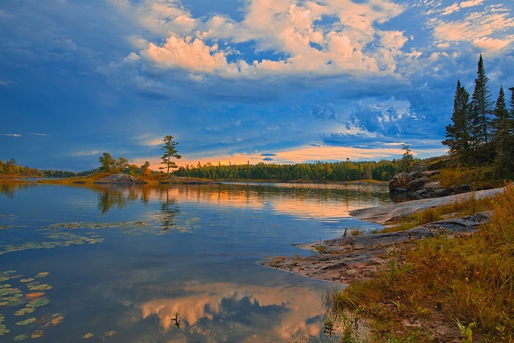 Canada-Ontario-Kenora District Forest autumn colors reflect on Middle Lake at sunrise art print by Jaynes Gallery for $57.95 CAD