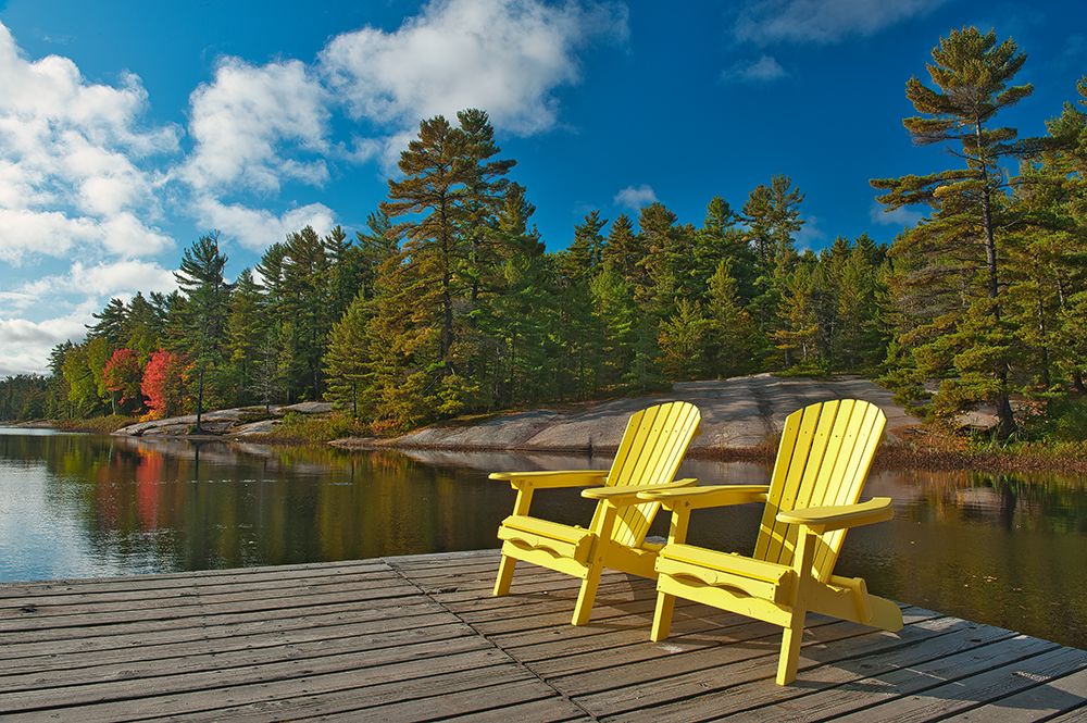 Canada-Ontario-Grundy Lake Provincial Park. Muskoka chairs on lake dock. art print by Jaynes Gallery for $57.95 CAD