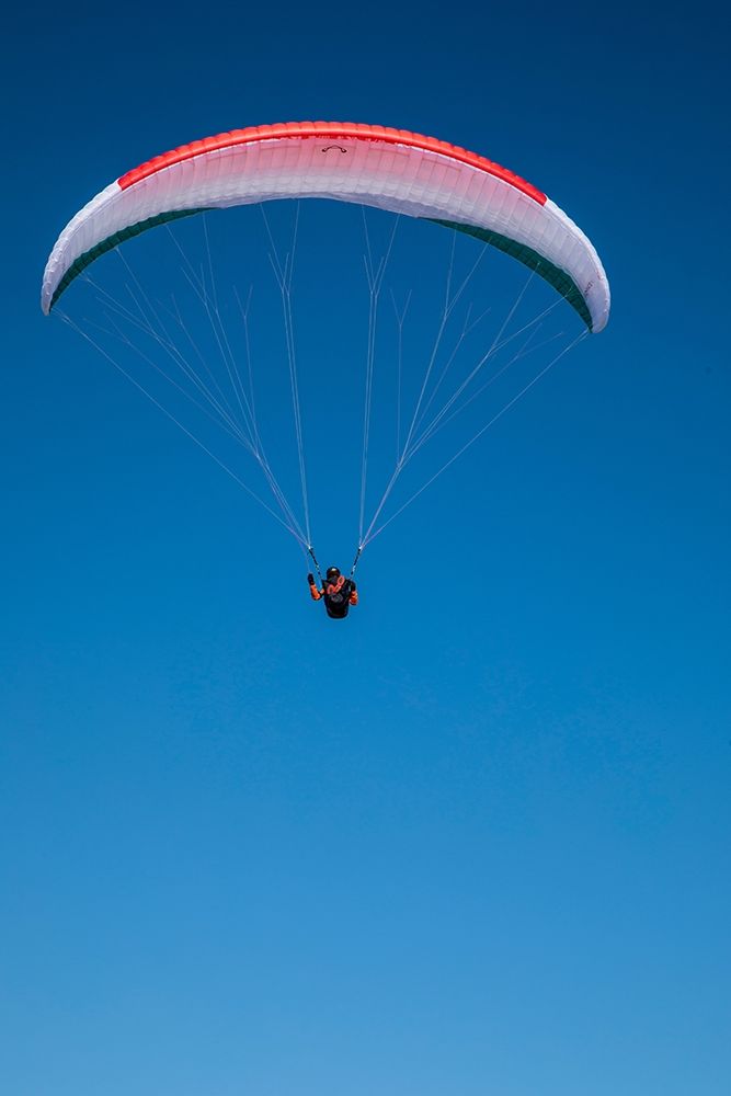 Austria-Dachstein-Paraglider soaring above Lake Hallstatt and the surrounding mountains art print by Hollice Looney for $57.95 CAD