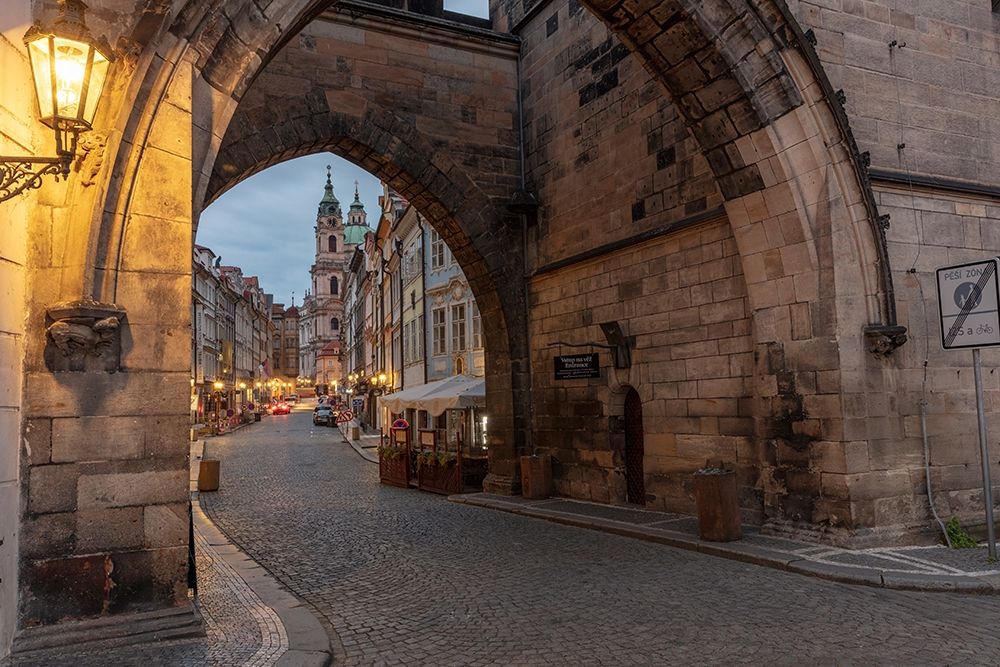 Arch of Lesser Town Bridge Tower on Charles Bridge with St Nicholas Church in Prague-Czech Republic art print by Chuck Haney for $57.95 CAD