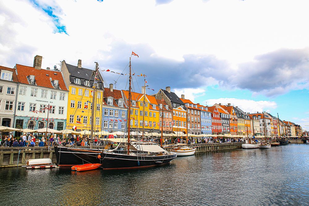 Copenhagen, Denmark. Nyhavn, painted houses by canal. art print by Jolly Sienda for $57.95 CAD