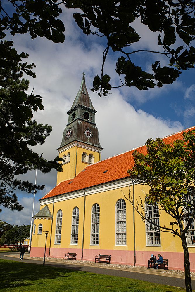 Skagen, Denmark. Ved Church with terra cotta tile roof. art print by Jolly Sienda for $57.95 CAD