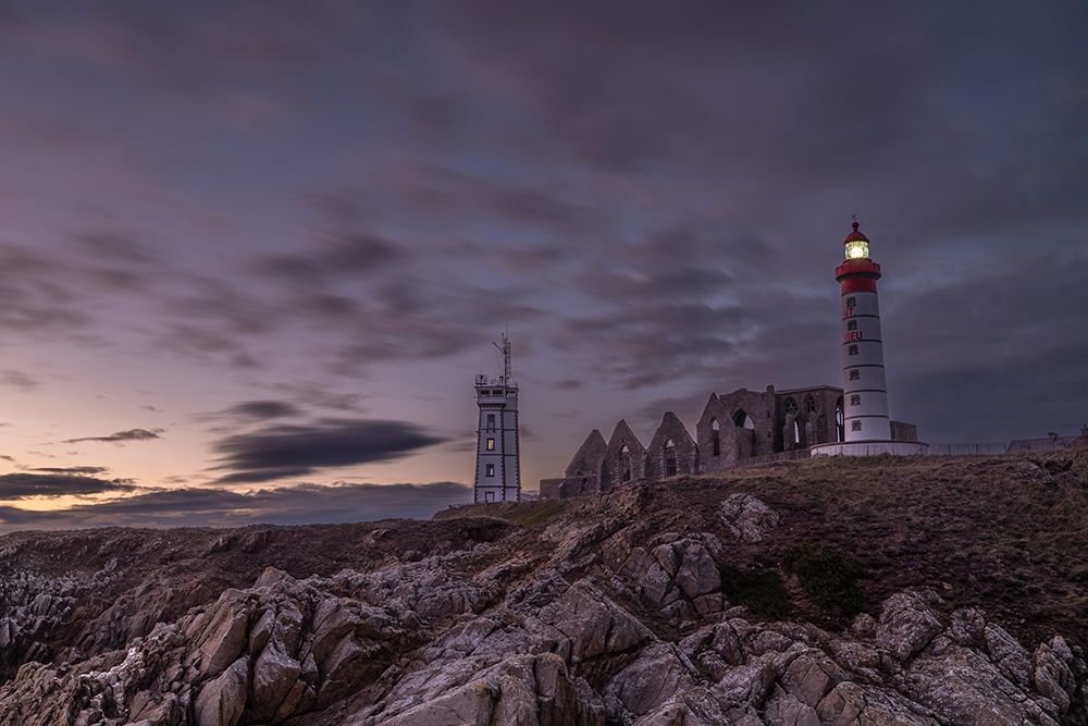 France-Brittany Ruins of the Abbey of Saint Mathieu and the Saint Mathieu Lighthouse at sunset art print by Hollice Looney for $57.95 CAD