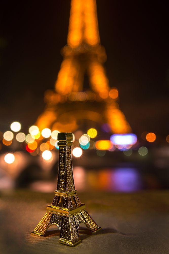 A souvenir Eiffel Tower on the wall of the Seine River across from the real thing art print by Steve Mohlenkamp for $57.95 CAD