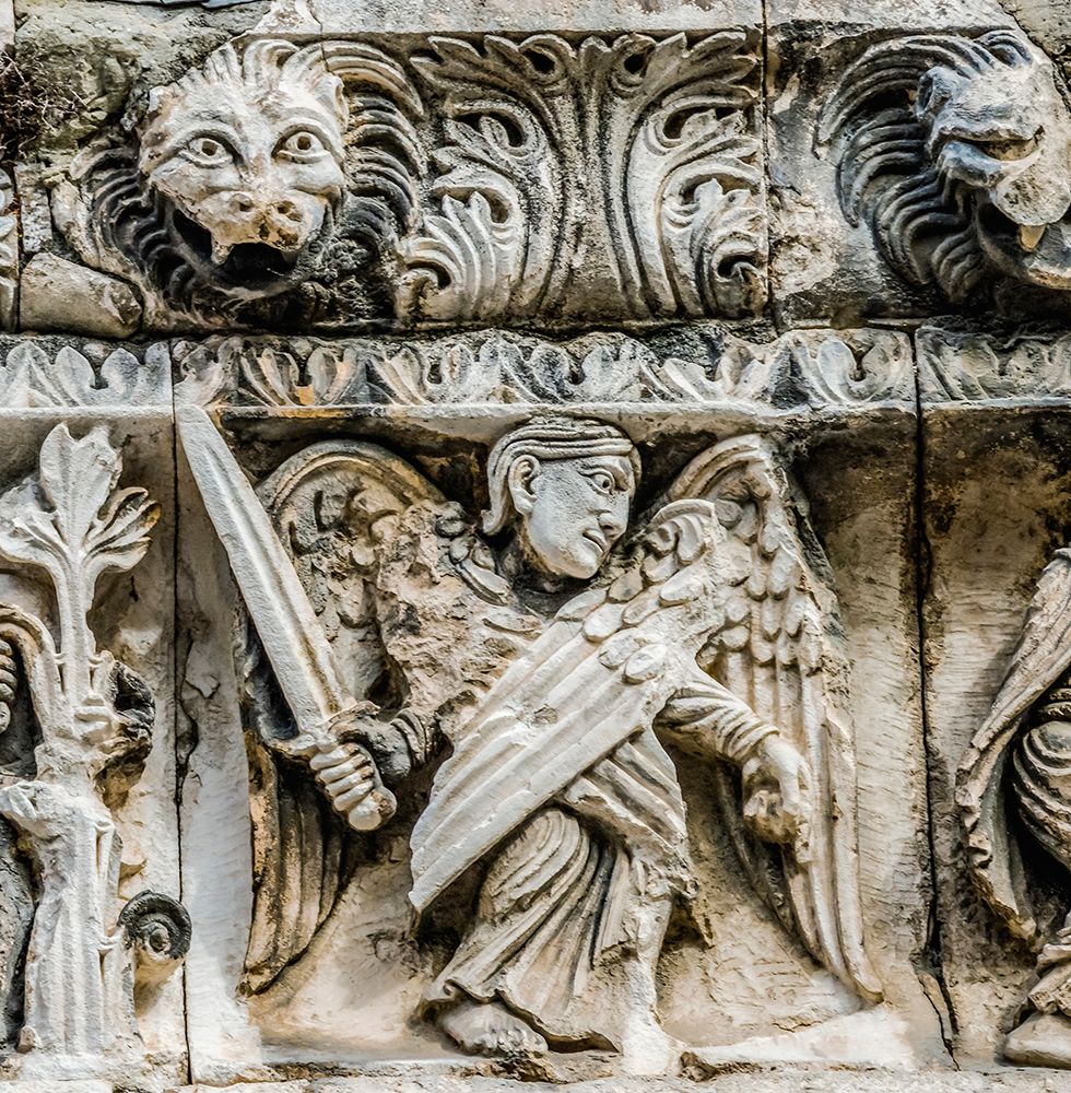 Saint Michael angel statue facade- Nimes Cathedral- Gard- France. Created 1100 AD- art print by William Perry for $57.95 CAD
