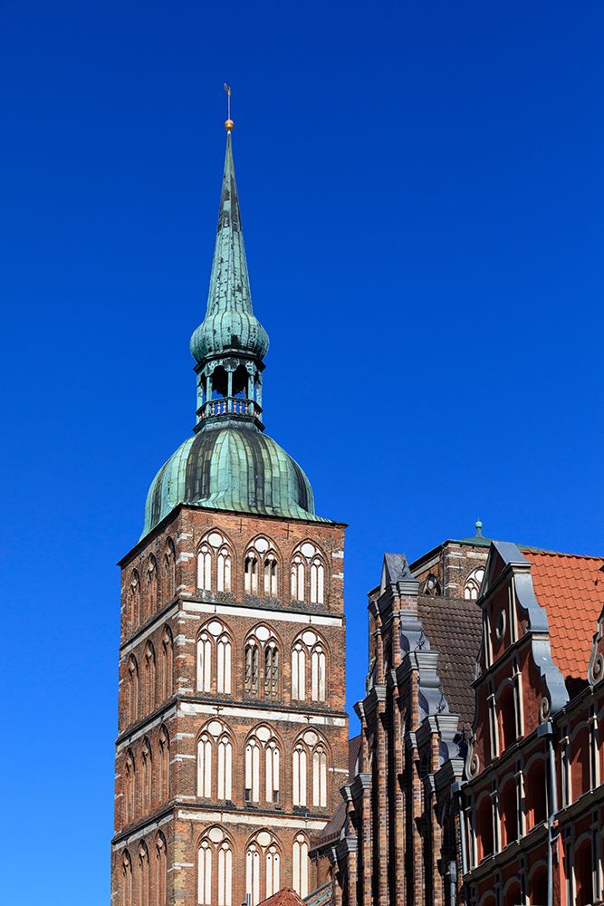 Germany, Mecklenburg-Vorpommern, Stralsund. Copper steeple of Saint Nicholas Church, UNESCO Site. art print by Emily M. Wilson for $57.95 CAD