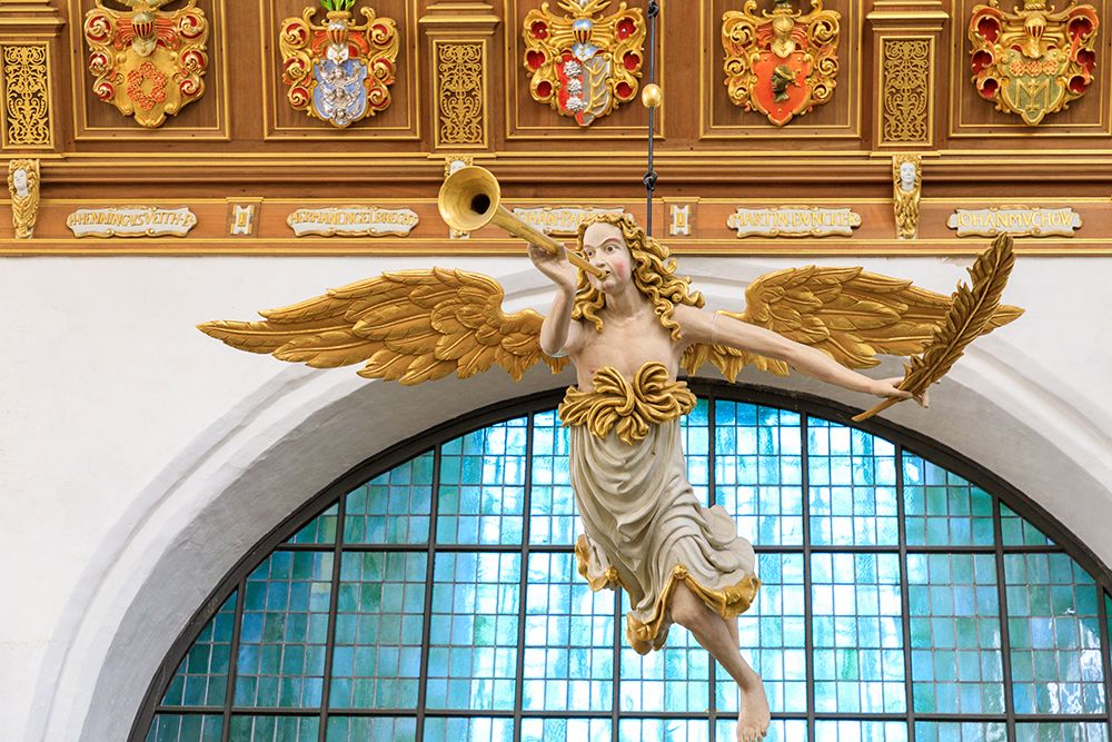 Germany, Mecklenburg-Vorpommern, Stralsund. St. Marys Churche. Figure of angel blowing trumpet. art print by Emily M. Wilson for $57.95 CAD
