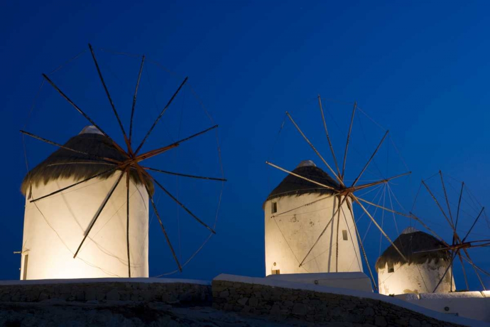Greece, Mykonos, Hora Windmills lit at sunset art print by Bill Young for $57.95 CAD