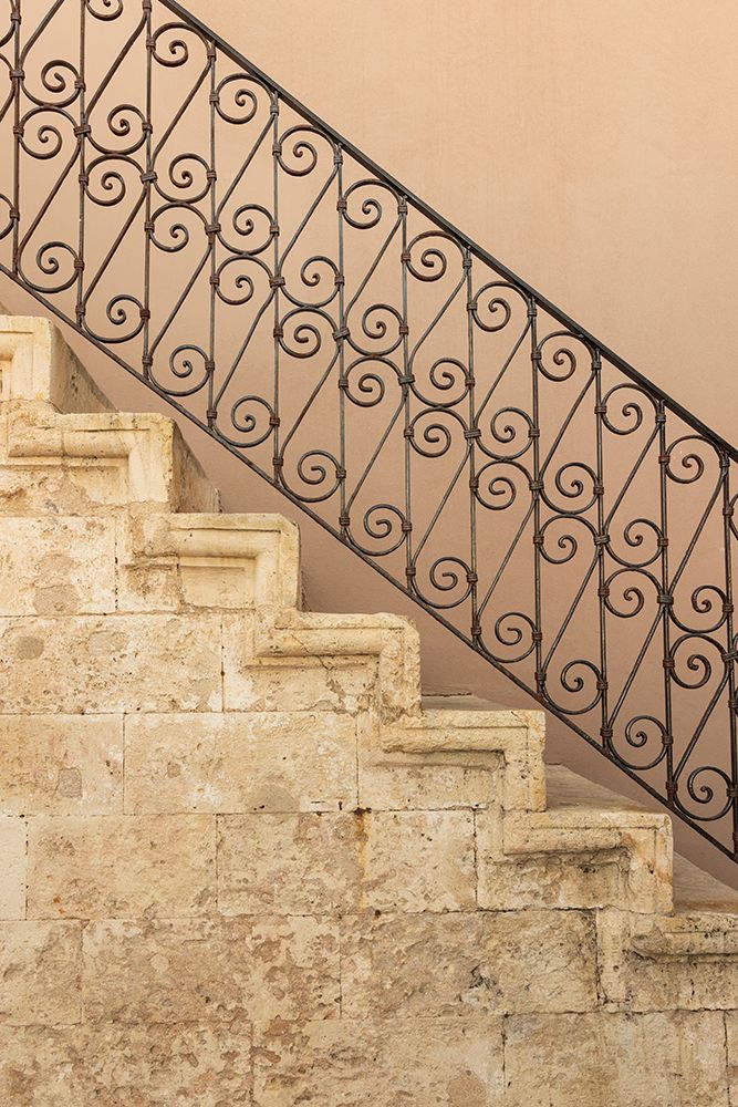Stone staircase with ornate wrought iron balustrade. Greece, Crete, Chania. art print by Emily M. Wilson for $57.95 CAD