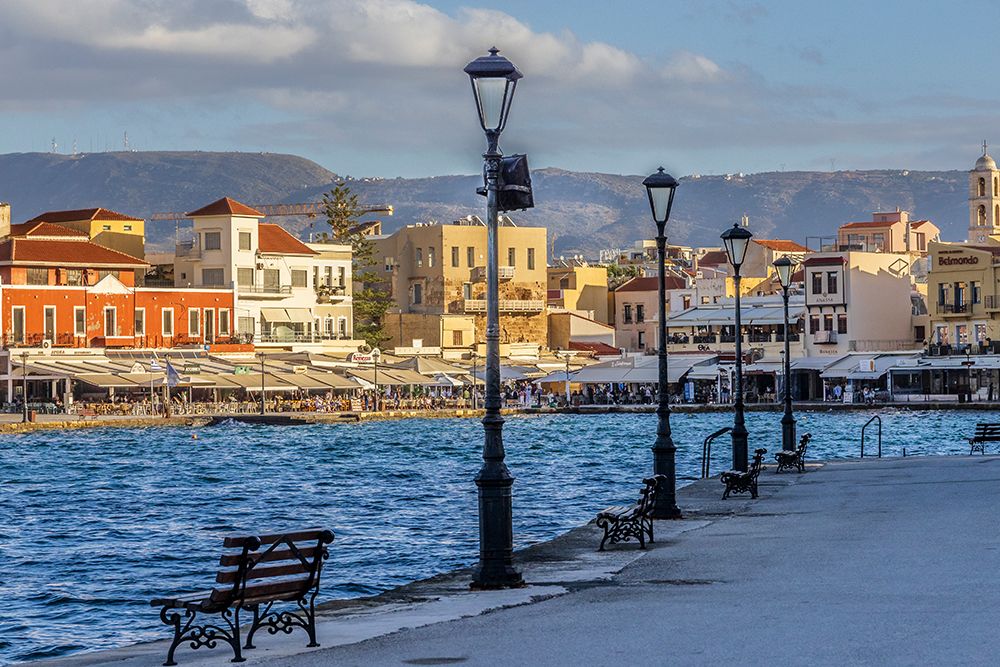 Greece, Crete, Chania, Old Town. View of the Venetian port or harbor, surrounded by cafes. art print by Emily M. Wilson for $57.95 CAD