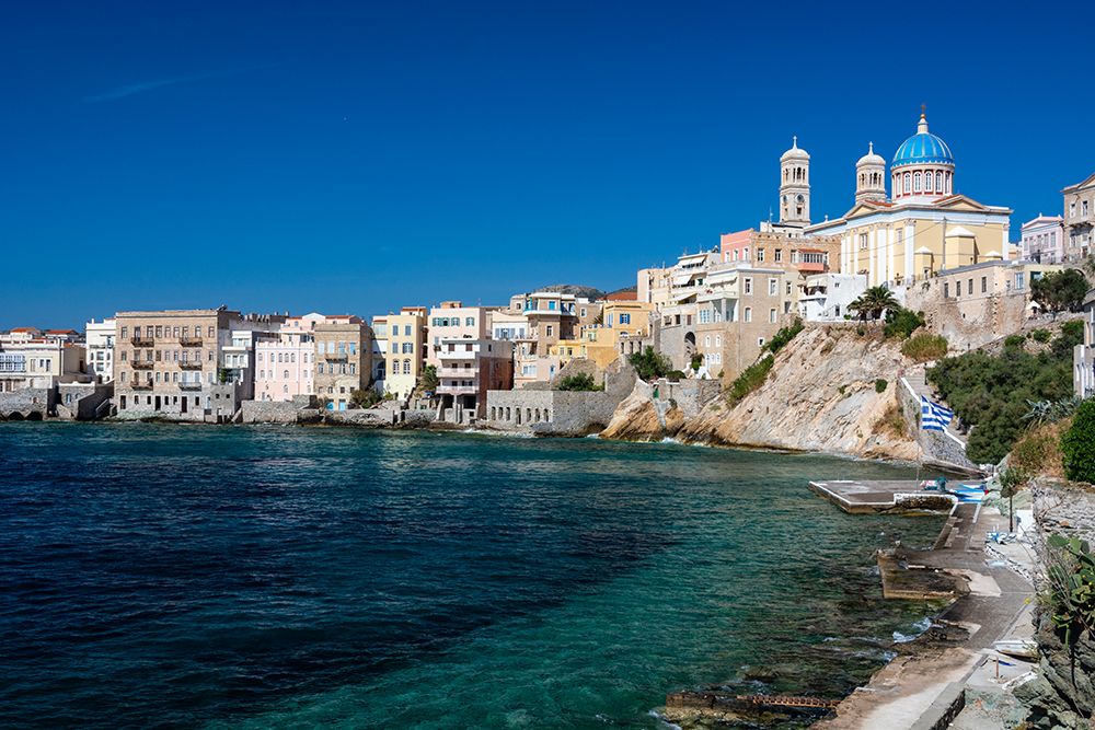 Agios Nikolaos Church-and houses long the shore in Ermoupoli-Siros Island-Greece art print by Sergio Pitamitz for $57.95 CAD