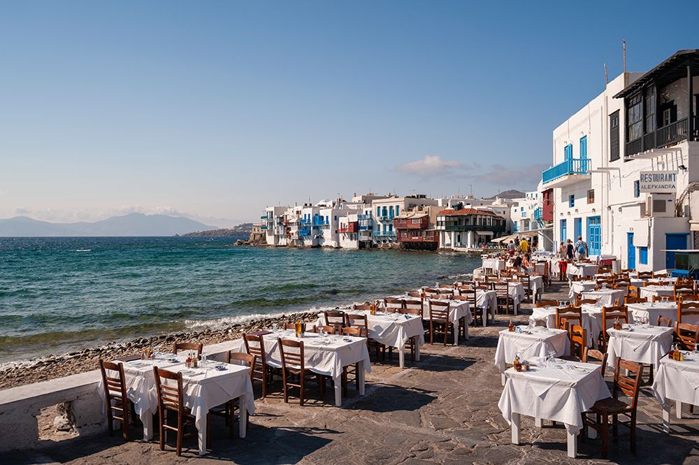 Restaurant tables on the seaside in the Little Venice neighborhood Chora-Mykonos Island-Greece art print by Sergio Pitamitz for $57.95 CAD