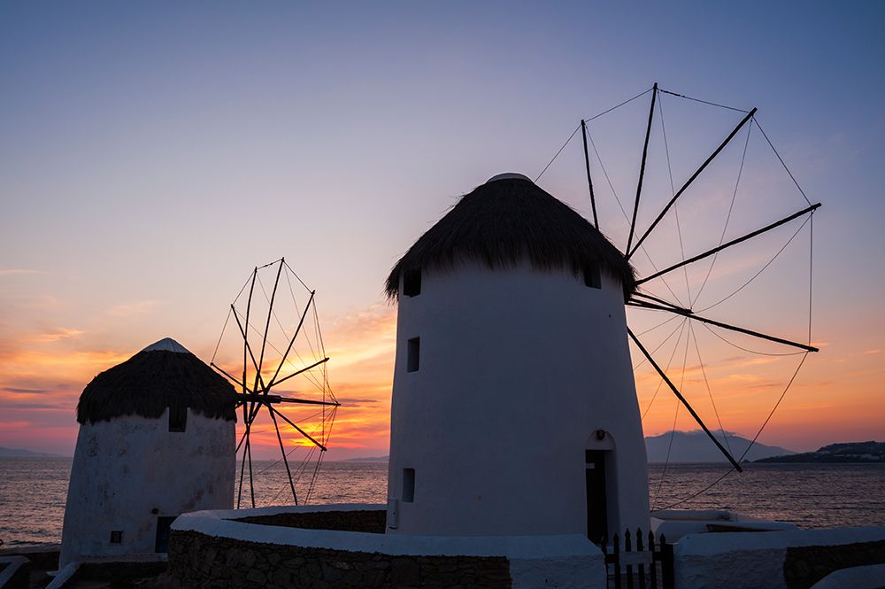 Traditional-style windmills on the coast at sunset Chora-Mykonos Island-Greece art print by Sergio Pitamitz for $57.95 CAD