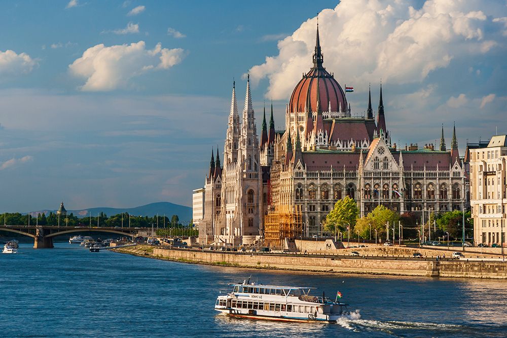 Tour boat passes Hungarys Parliament-built between 1884-1902 is the countrys largest building-It ha art print by Tom Haseltine for $57.95 CAD