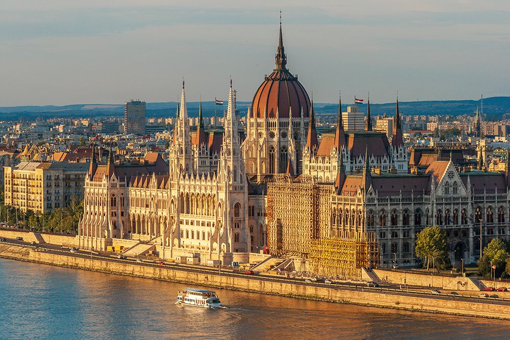 Tour boat passes Hungarys Parliament-built between 1884-1902 is the countrys largest building-It ha art print by Tom Haseltine for $57.95 CAD