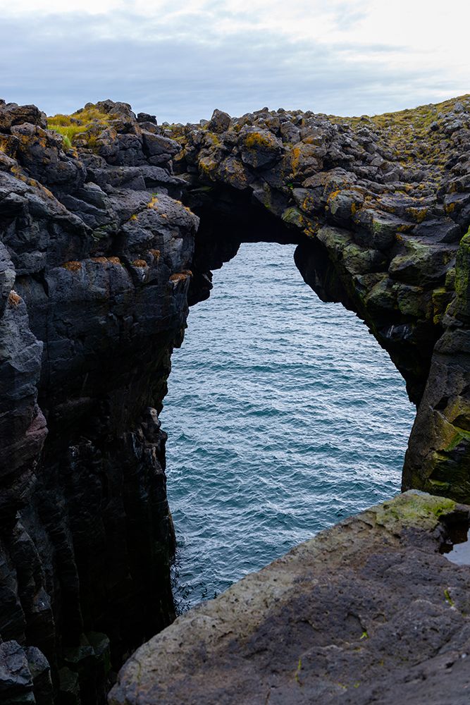 Iceland. Natural arch in Snaefellsnes National Park on the Grundarfjordur fjord. art print by Alison Wright for $57.95 CAD