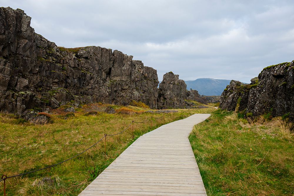 Thingvellir National Park, Iceland. Wooden boardwalk thorough landscape in park. art print by Alison Wright for $57.95 CAD