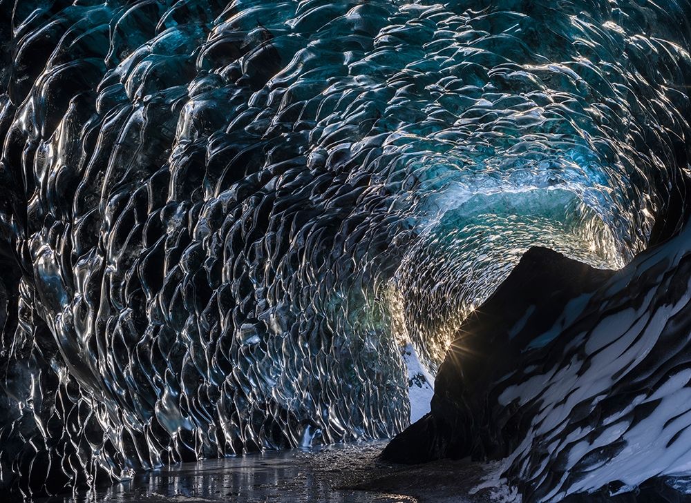 Ice cave at the northern shore of glacial lagoon Jokulsarlon in glacier Breidamerkurjokull art print by Martin Zwick for $57.95 CAD