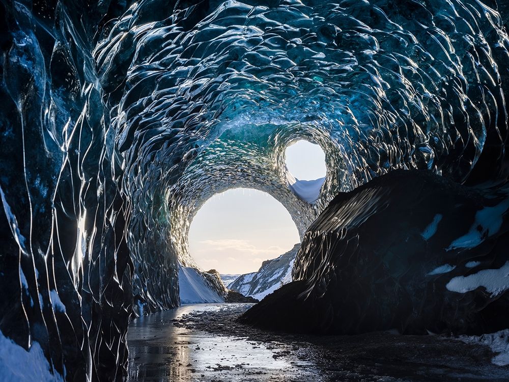 Ice cave at the northern shore of glacial lagoon Jokulsarlon in glacier Breidamerkurjokull art print by Martin Zwick for $57.95 CAD