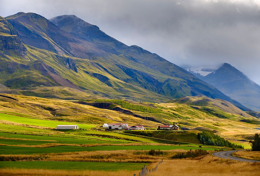 Mountains towering over Oxnadalur with road climbing up to Oxnadalsheidi. Europe- Iceland art print by Martin Zwick for $57.95 CAD