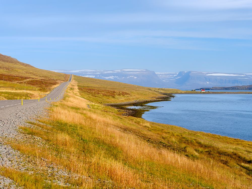 Iceland. Landscape in fjord Seydisfjordur with church Eyri during autumn. art print by Martin Zwick for $57.95 CAD