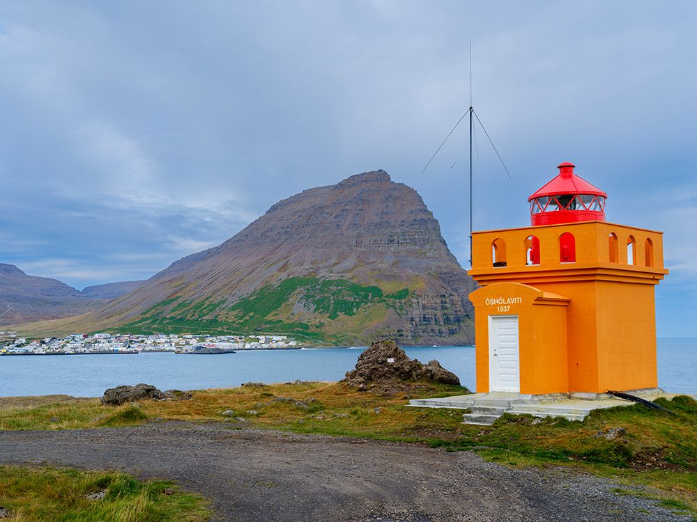 Iceland. Lighthouse Osholar, Bolungarvik at fjord Isafjardardjup during autumn. art print by Martin Zwick for $57.95 CAD