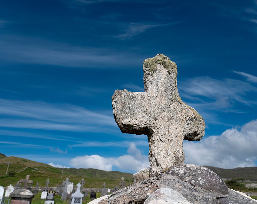 Worn stone cross adorns a grave in Kildavnet-Achill Island-County Mayo-Ireland. art print by Betty Sederquist for $57.95 CAD