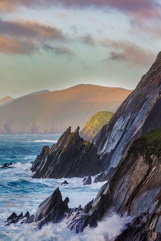 Waves crash into cliffs on Dunmore Head with Blasket Islands on the Dingle Peninsula-Ireland art print by Chuck Haney for $57.95 CAD