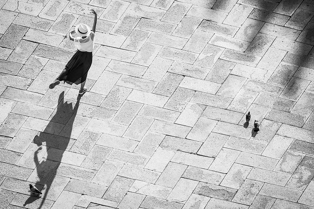Europe-Italy-Venice-Black and white of tourist poising for photo on San Marco Square art print by Jaynes Gallery for $57.95 CAD