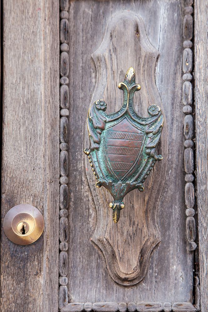 Italy-Venice-Burano Island Closeup of brass detail on an old wooden door on Burano Island art print by Julie Eggers for $57.95 CAD