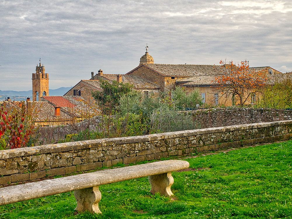 Italy-Tuscany-Province of Siena-Montalcino Stone bench overlooking the town of Montalcino art print by Julie Eggers for $57.95 CAD