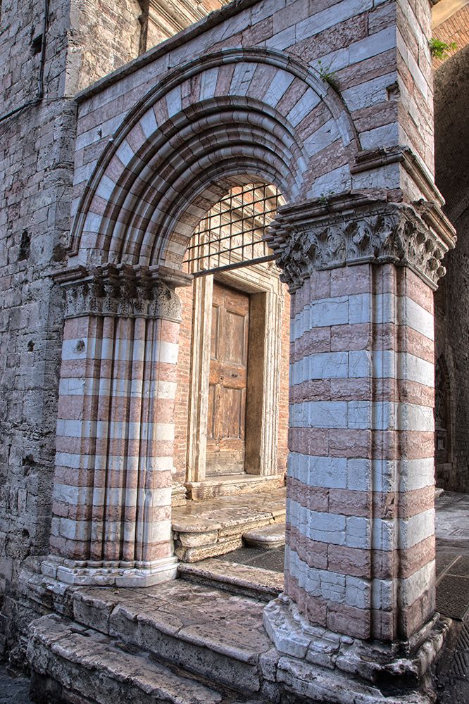 Italy- Umbria- Perugia. Striped archway near the Cathedral of San Lorenzo in Piazza IV Novembre. art print by Julie Eggers for $57.95 CAD