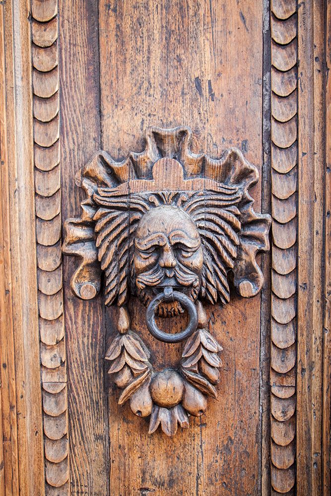 Italy- Umbria- Assisi. Ornate wood carved door knocker. art print by Julie Eggers for $57.95 CAD