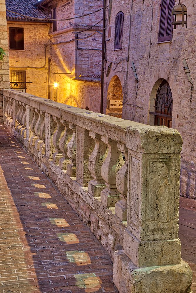 Italy- Umbria- Assisi. Short stone wall with columns near the Convento Chiesa Nuova. art print by Julie Eggers for $57.95 CAD