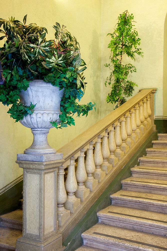 Italy- Umbria- Spoleto. Concrete urn filled with greenery on the end of a banister of a staircase. art print by Julie Eggers for $57.95 CAD