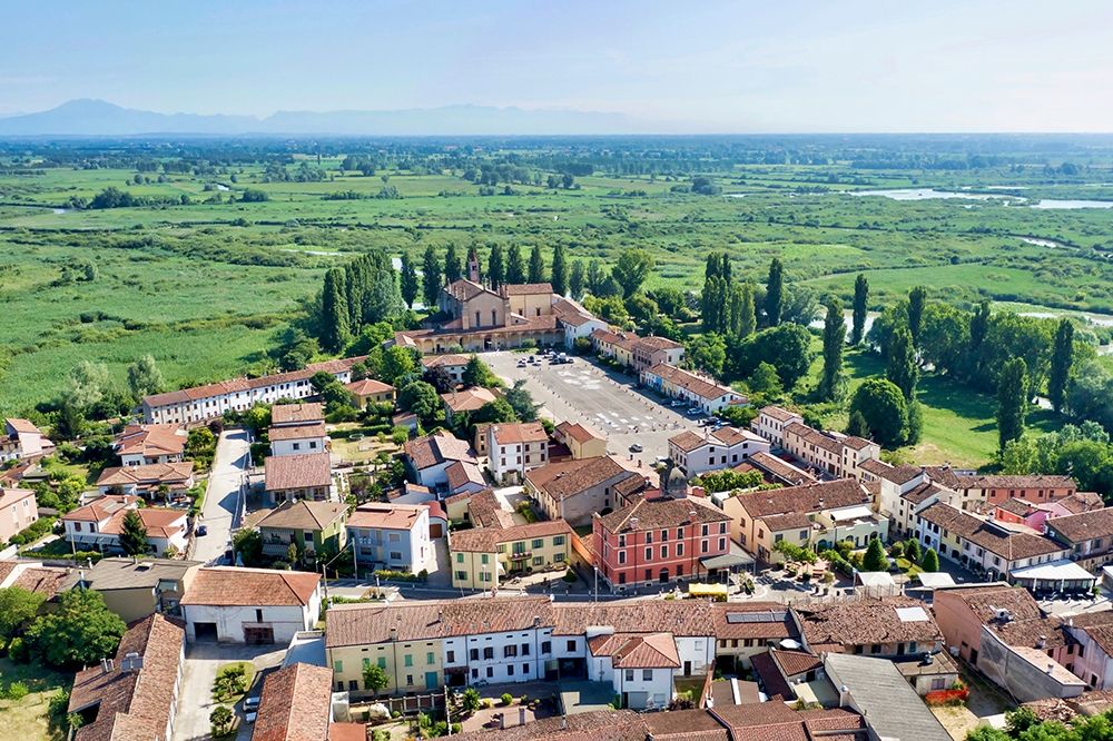 Italy-Mantova-Le Grazie village-Basilica and square-Mincio river valley in the background art print by Michele Molinari for $57.95 CAD
