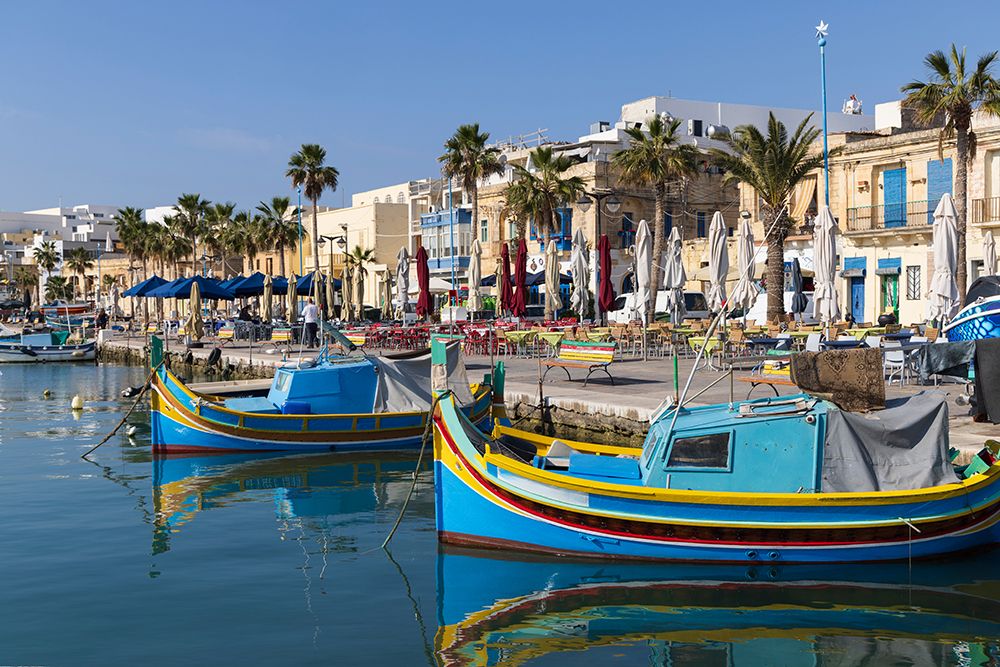 Malta, Marsaxlokk. Marsaxlokk harbor. Luzzijiet, colorful traditional Maltese fishing boats. art print by Emily M. Wilson for $57.95 CAD