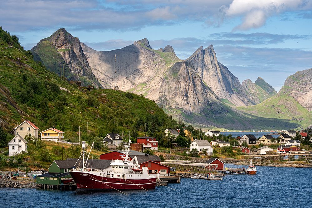 Norway, Reine. Fishing village houses and boats with mountain landscape. art print by Jaynes Gallery for $57.95 CAD