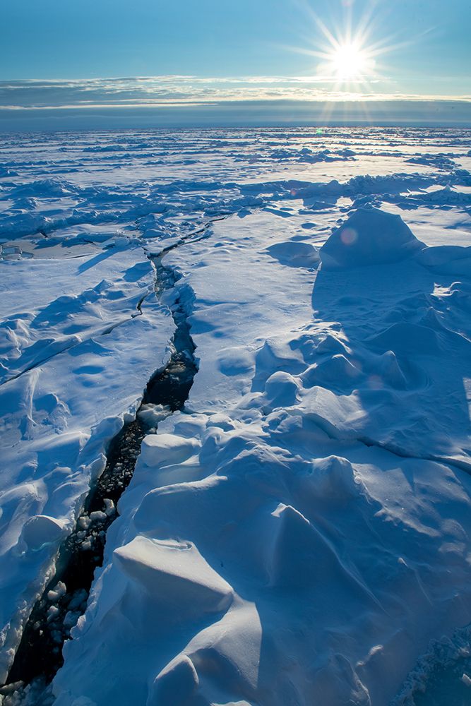 Norway Icescape at 84 degrees north-crack in ice with sunburst art print by Cindy Miller Hopkins for $57.95 CAD