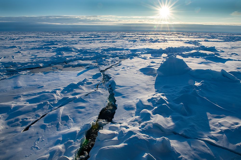 Norway Icescape at 84 degrees north-crack in ice with sunburst art print by Cindy Miller Hopkins for $57.95 CAD