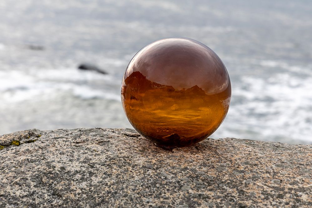 Norway- Lofoten Islands- Vareid. Mountains and ocean viewed through a glass ball art print by Hollice Looney for $57.95 CAD