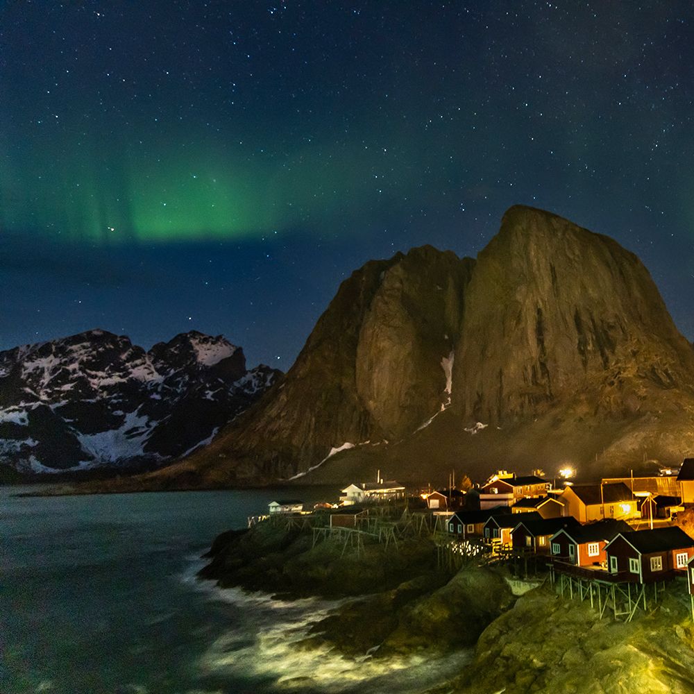 Norway- Lofoten Islands. Aurora Borealis In the sky above Hamnoy in Reine art print by Hollice Looney for $57.95 CAD