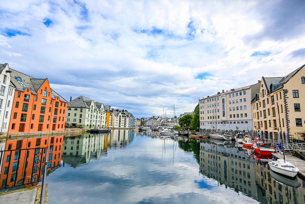 Alesund, Norway. Colorful painted buildings and marina. art print by Jolly Sienda for $57.95 CAD