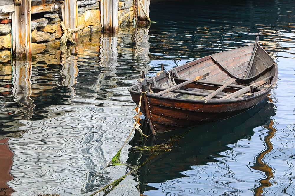 Alesund, Norway. Brown wooden canoe, water reflection. art print by Jolly Sienda for $57.95 CAD