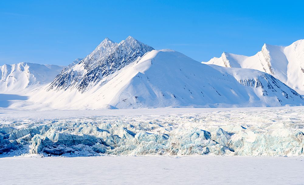 Glacier front of Fridtjovbreen and the frozen fjord Van Mijenfjorden Island of SpitsbergenNorway art print by Martin Zwick for $57.95 CAD