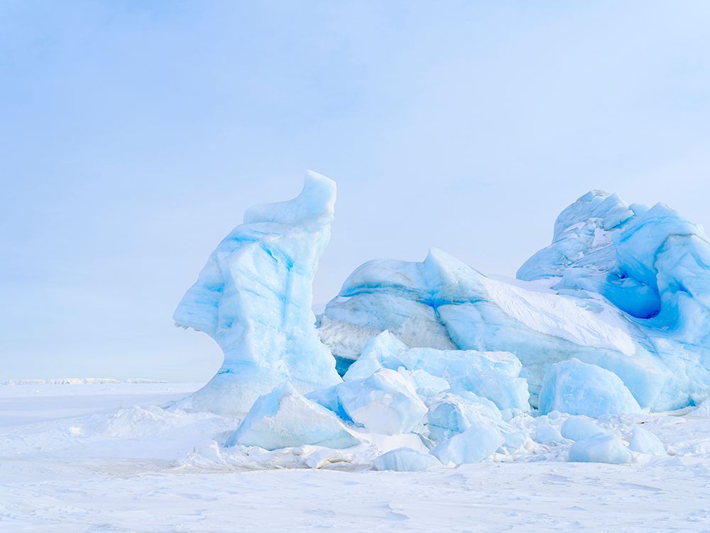 Iceberg in the frozen Mohnbukta in Sabine-Land. Spitzbergen in the Svalbard. Scandinavia, Norway. art print by Martin Zwick for $57.95 CAD