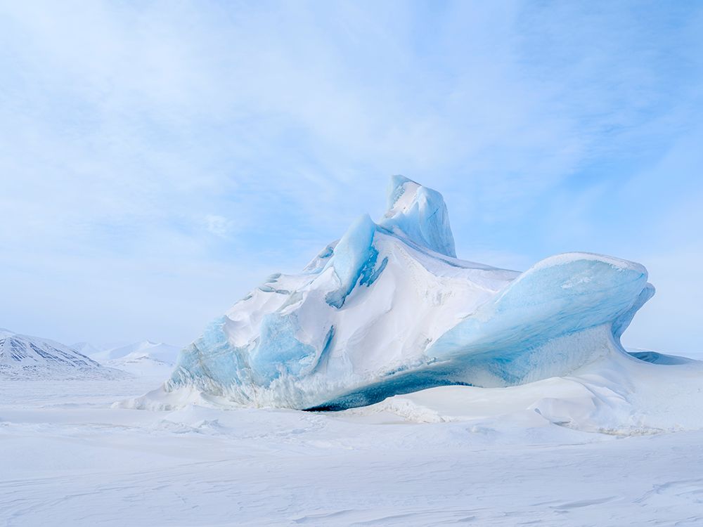 Iceberg in the frozen Mohnbukta in Sabine-Land. Spitzbergen in the Svalbard. Scandinavia, Norway. art print by Martin Zwick for $57.95 CAD